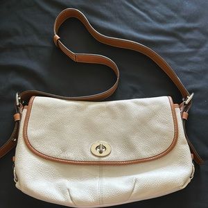 White cream leather Coach bag with silver hardware, light pink on inside.